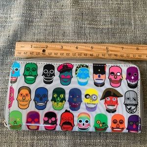 Like New, Pylones brand, skull print zip wallet.